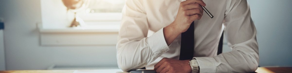 Man looks over report on his desk
