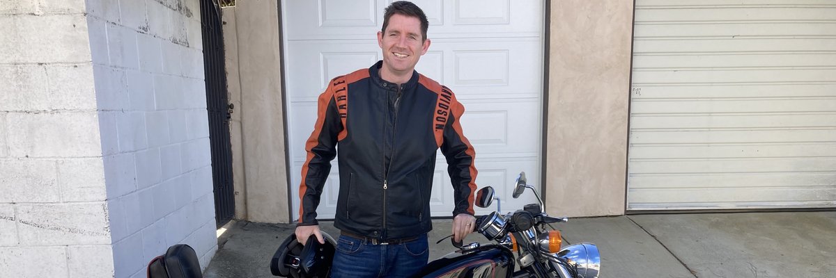 Joel with motorbike in LA.