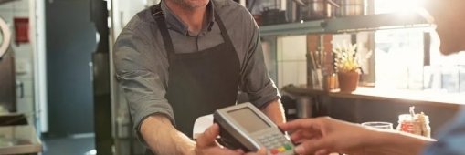 Man Holding Credit Card Reader.jpg