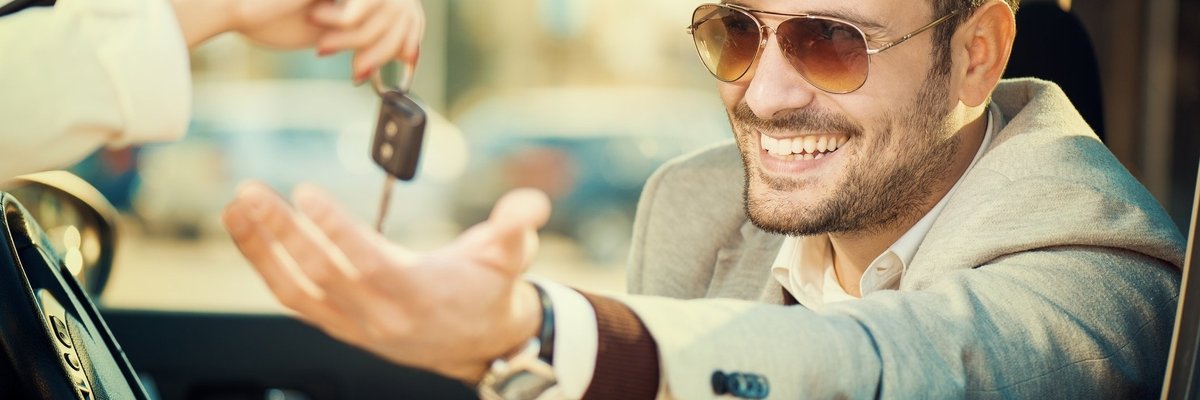 Man Taking Keys When Buying New Car