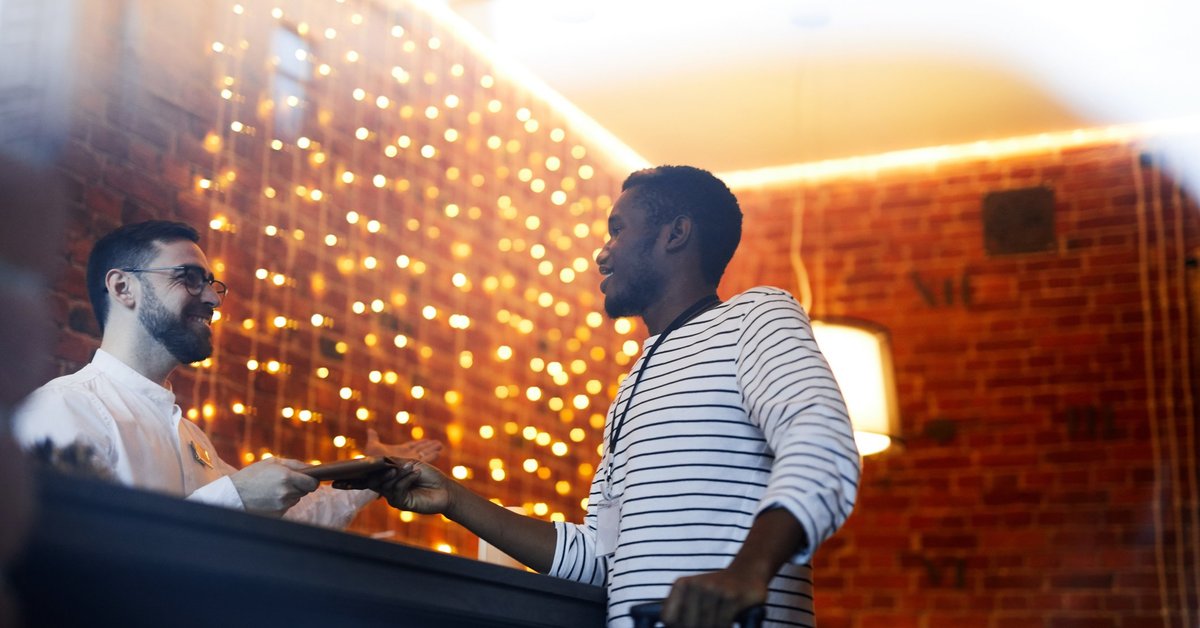 A man checking in to a hotel.