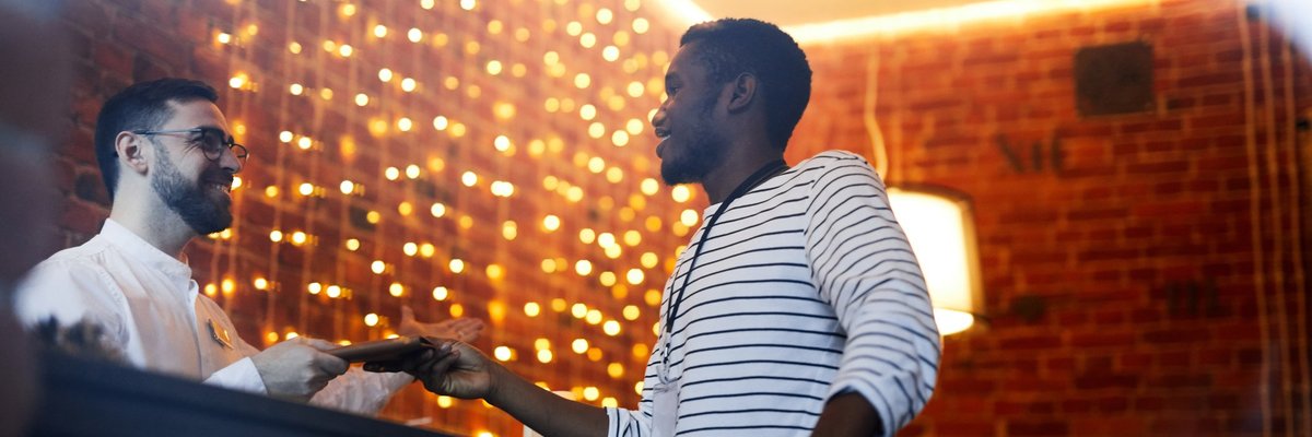 A man checking in to a hotel.