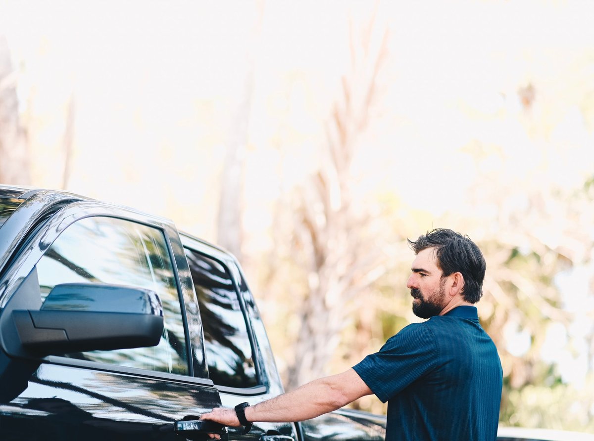 A man rides to his pickup truck