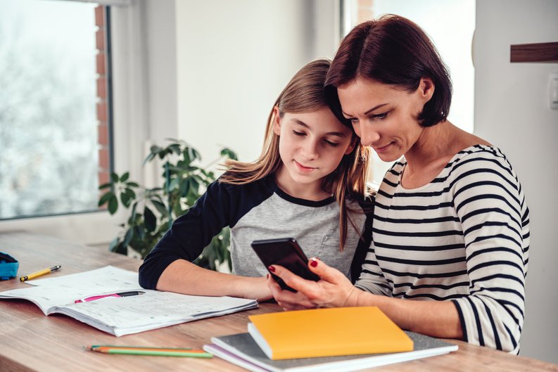 Mom Showing Daughter Her Phone