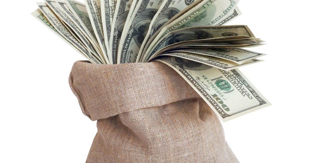 Burlap bag filled with $100 bills.