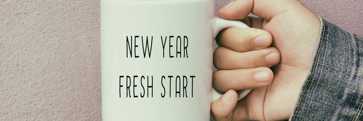 A coffee mug reading New Year Fresh Start.