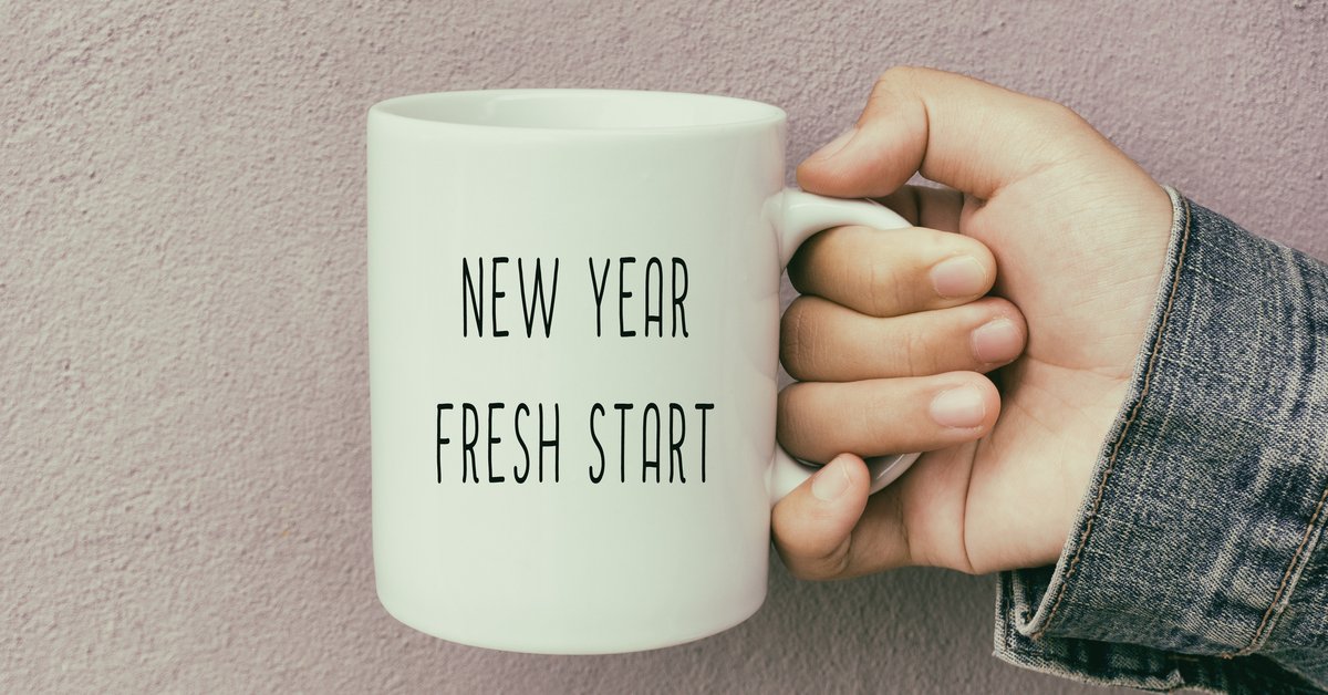 A coffee mug reading New Year Fresh Start.