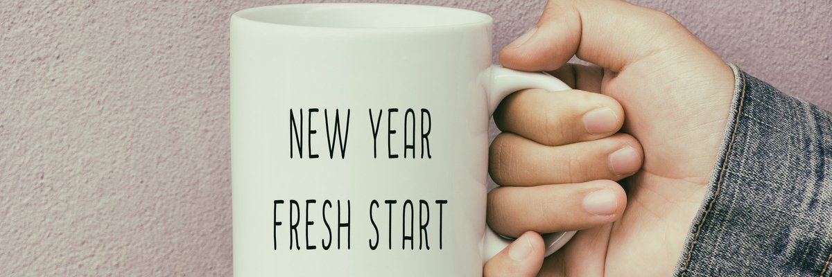 A coffee mug reading New Year Fresh Start.