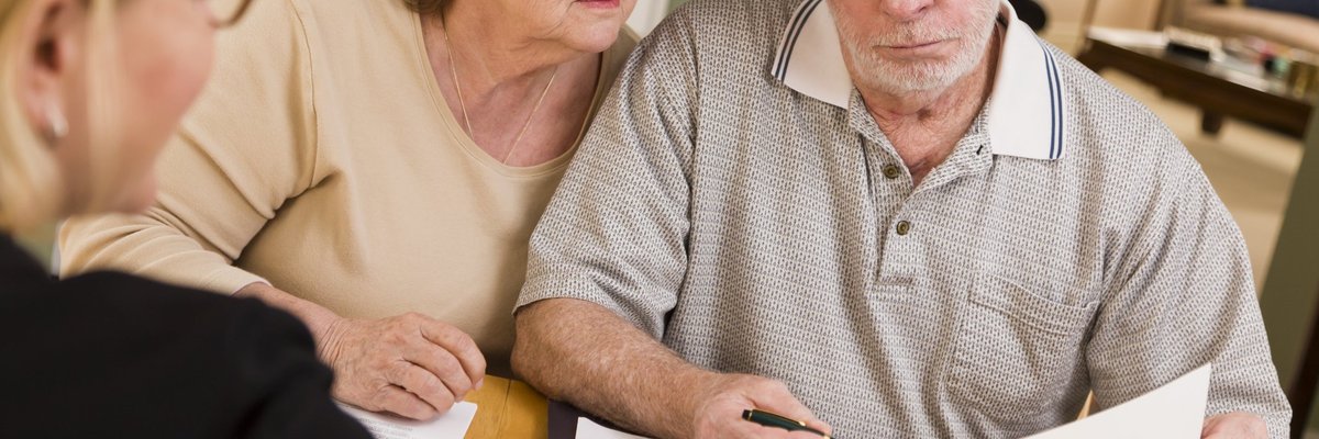 Older couple looking at financial paperwork