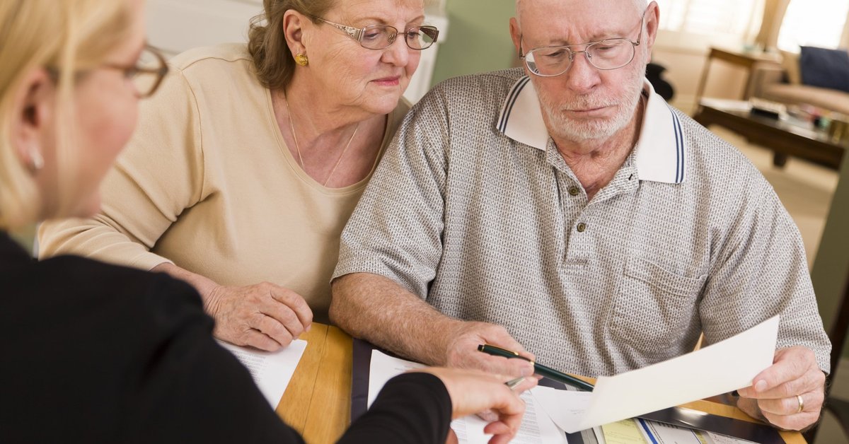 Older couple looking at financial paperwork
