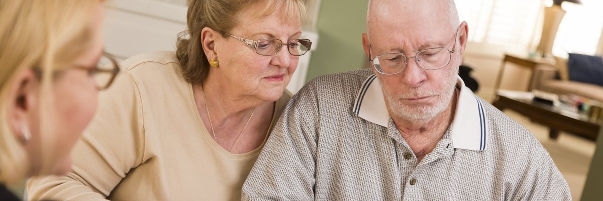 Older couple looking at financial paperwork