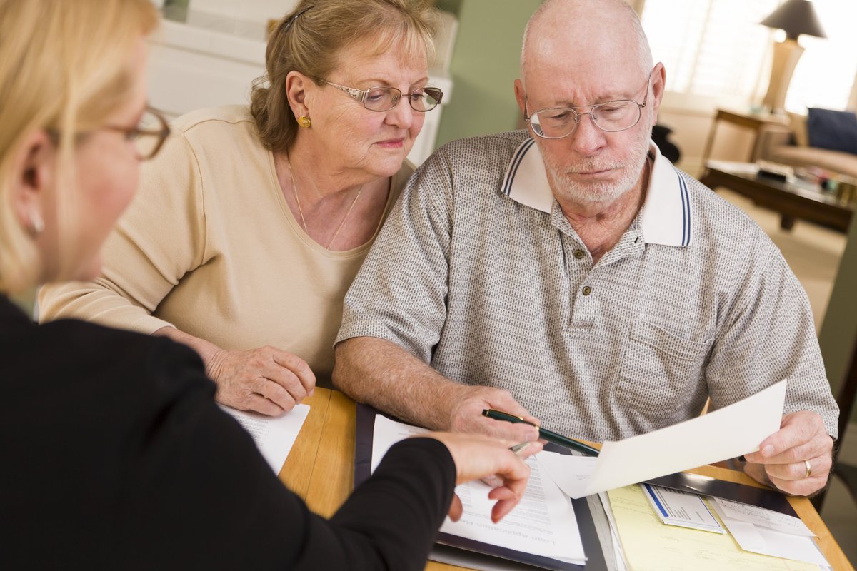 Older couple looking at financial paperwork