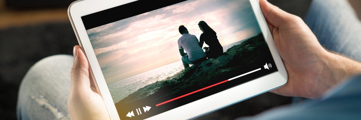 Person viewing a streaming service on a tablet.