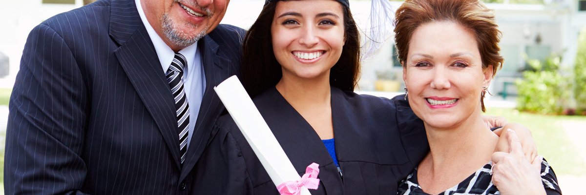 parents with college student at graduation