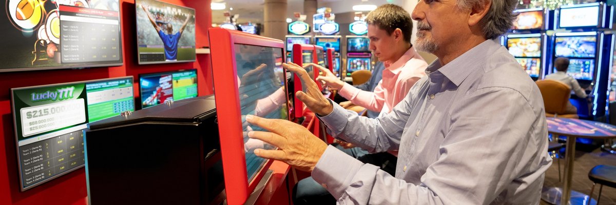 People partaking in sports gambling