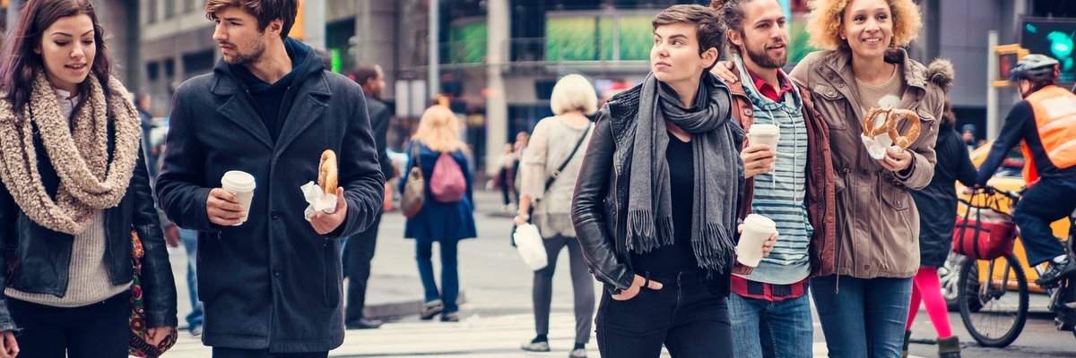 People walking across busy NYC street