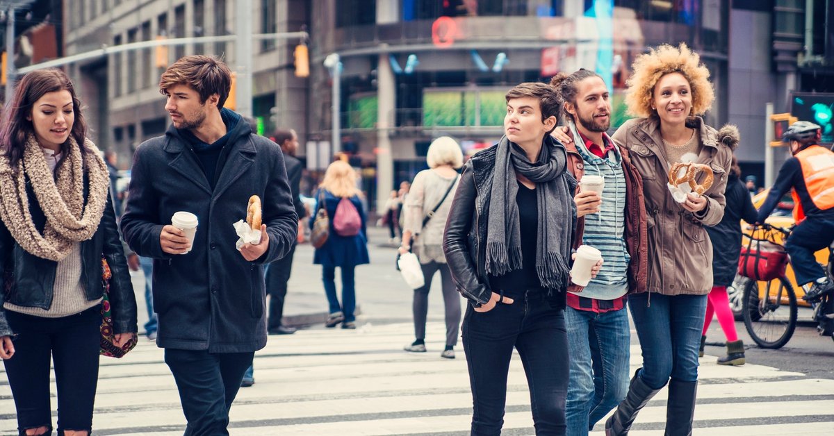 People walking across busy NYC street