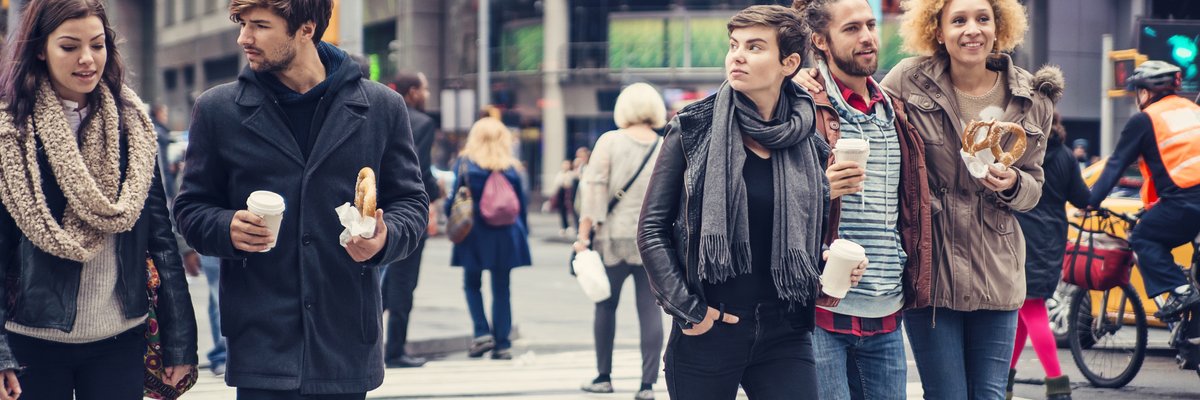 People walking across busy NYC street