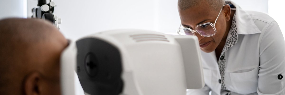 Person getting their eyes scanned by tech.