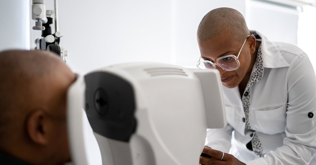 Person getting their eyes scanned by tech.