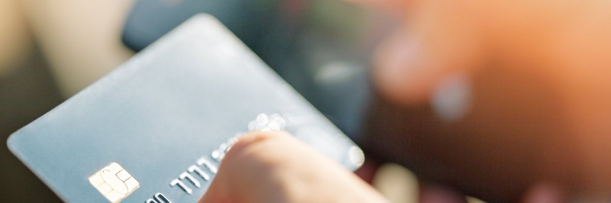 Person holding credit card