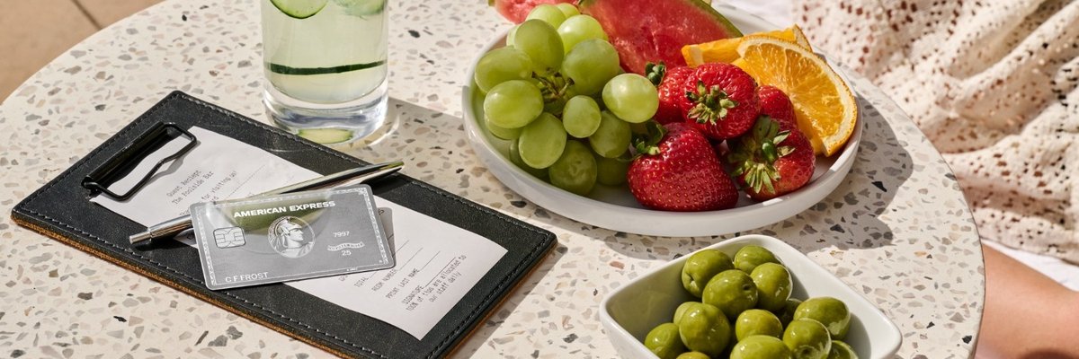 Amex Platinum mirror card design paying for breakfast meal.