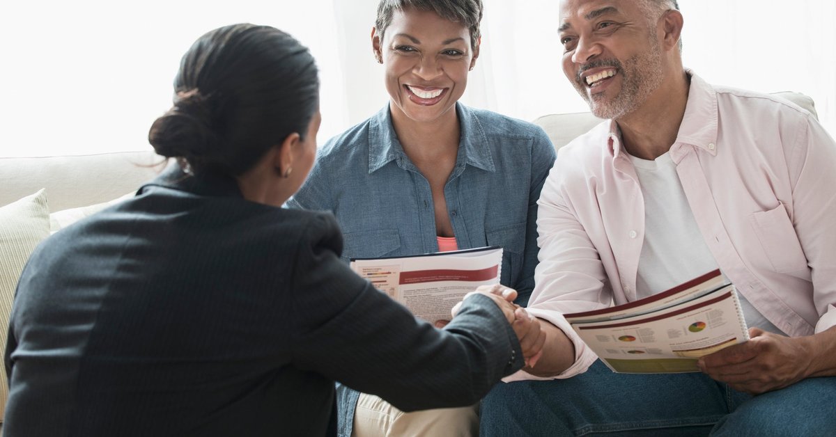 Professional woman meeting with clients.