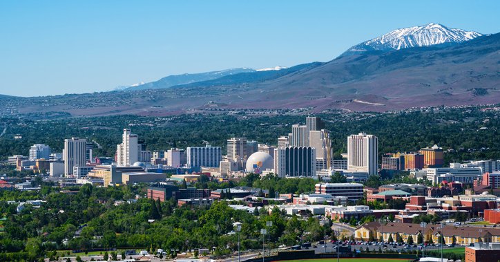 An aerial view of Reno, Nevada, with mountains in the background.