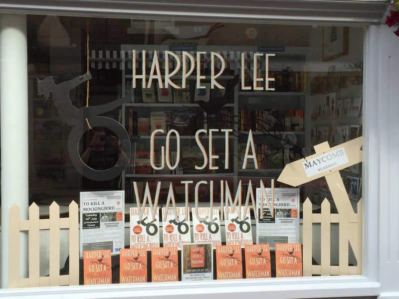 Bookstore window with the words Harper Lee and Go Set a Watchman written on the window.