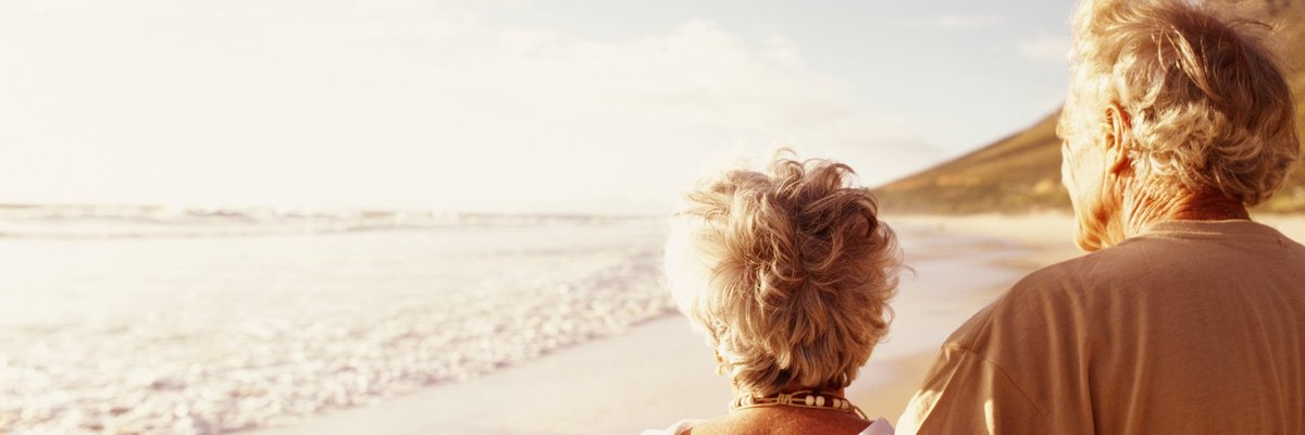Senior couple standing on beach