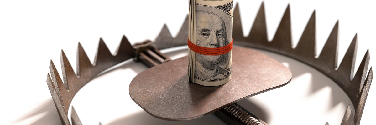 Roll of money in the center of a bear trap.