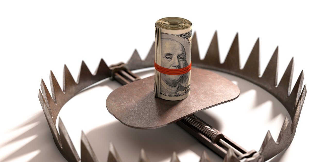 Roll of money in the center of a bear trap.
