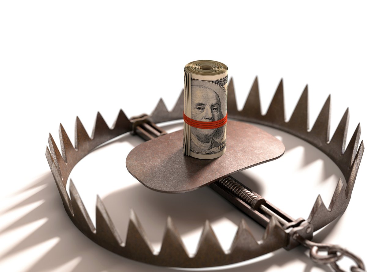 Roll of money in the center of a bear trap.