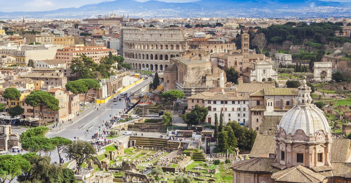 An aerial view of Rome and the Coliseum.