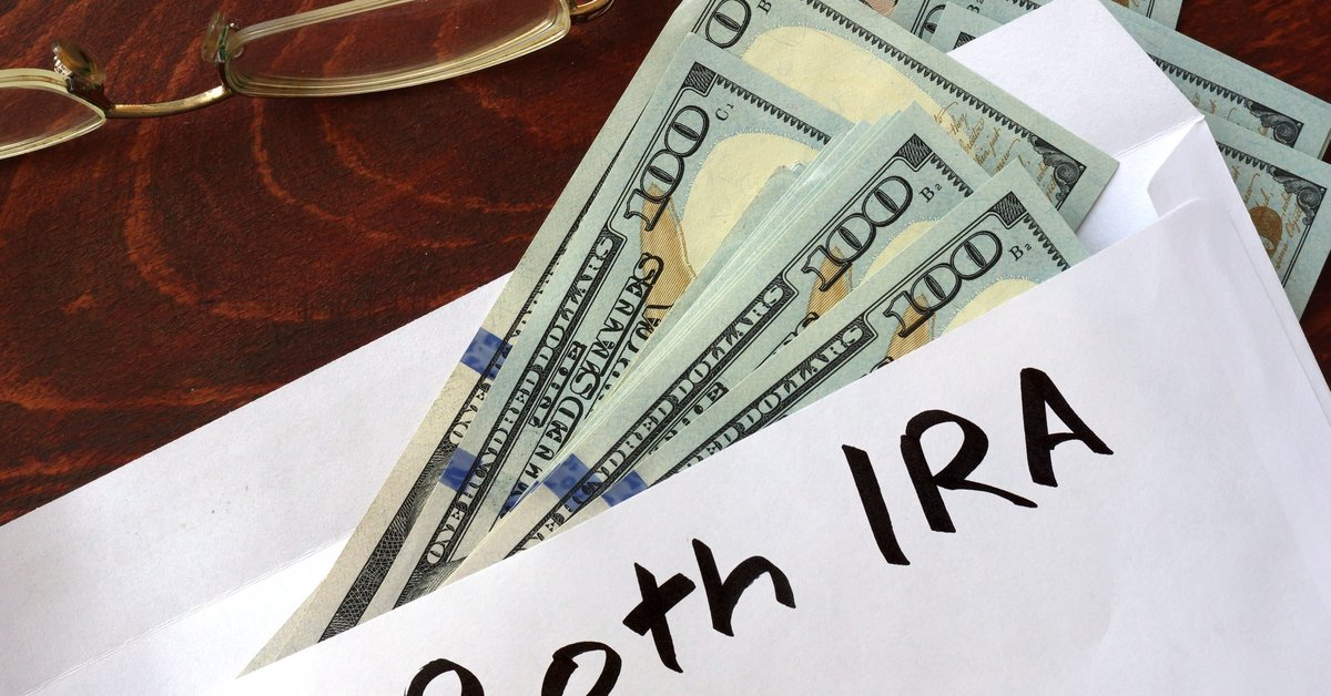 An envelope with Roth IRA written on it and $100 bills falling out.