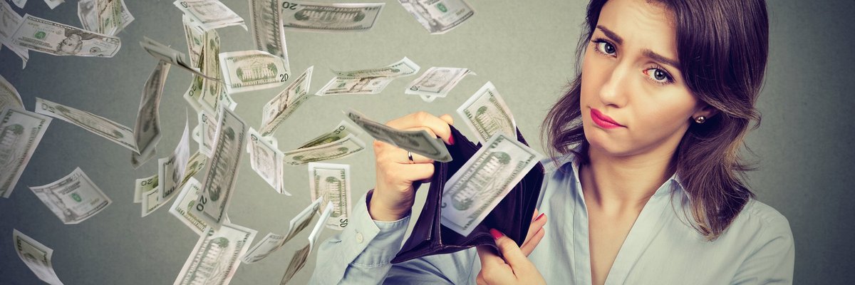 Sad woman with money flying out of wallet