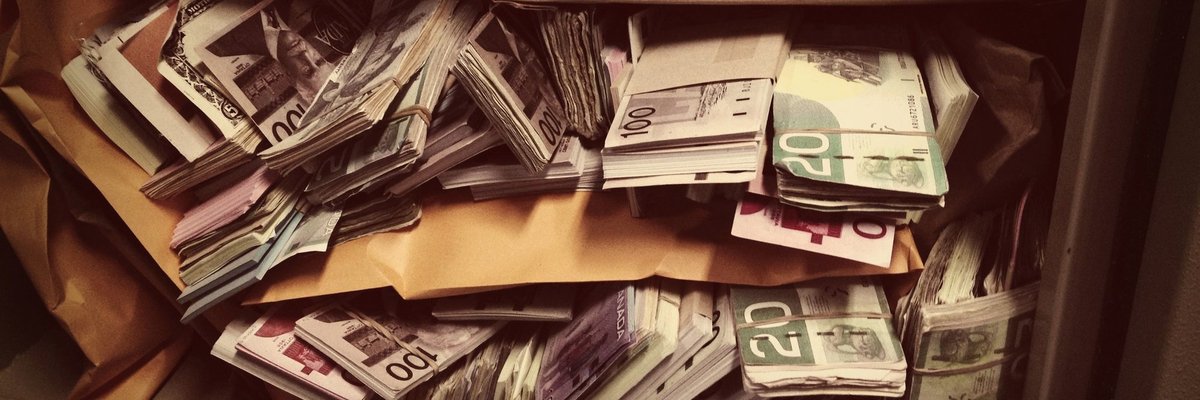 Vault filled with stacks and rolls of money.