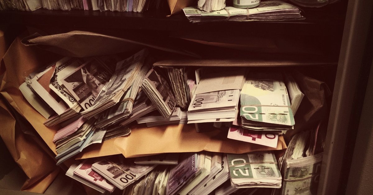 Vault filled with stacks and rolls of money.