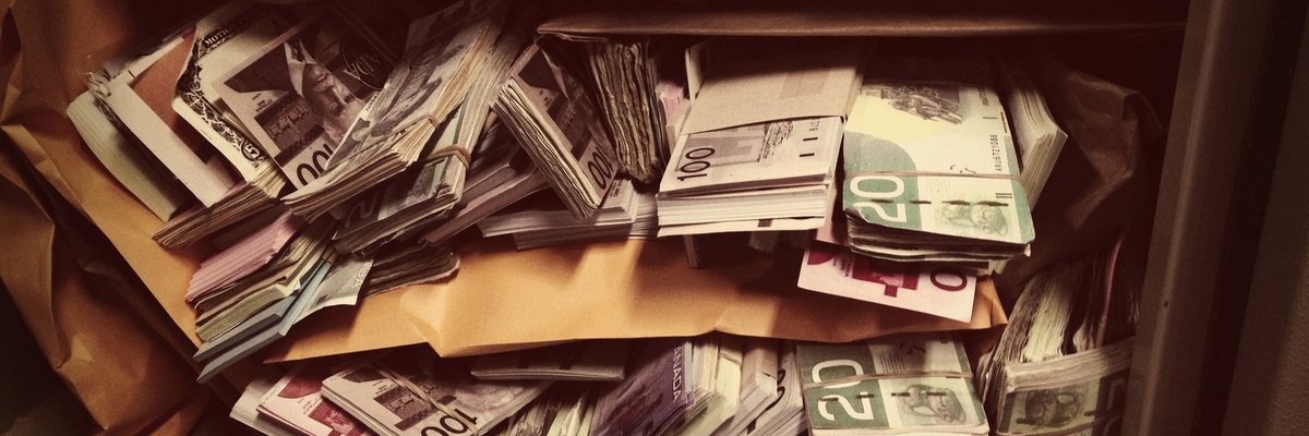 Vault filled with stacks and rolls of money.