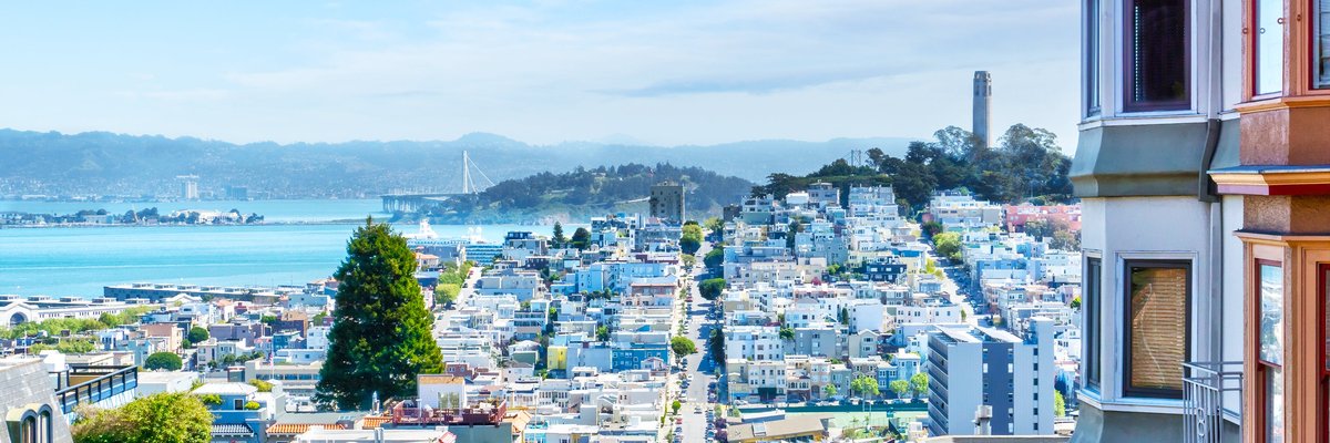 San Francisco apartments overlooking the hills and the Bay on a sunny day.
