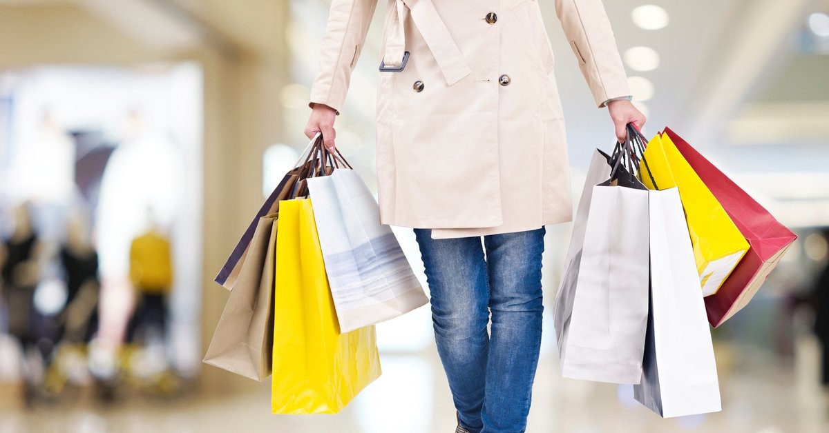 Woman Carrying Several Shopping Bags
