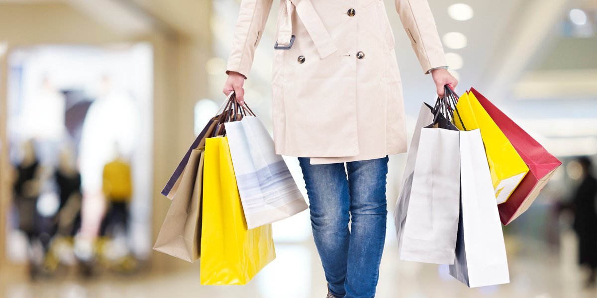 Woman Carrying Several Shopping Bags