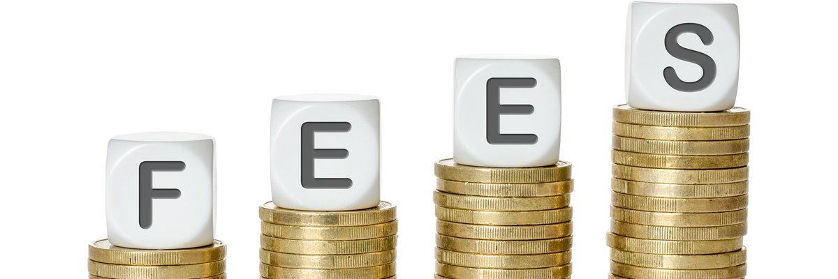 Stacks of coins in increasing size with blocks spelling the word FEES atop the piles.