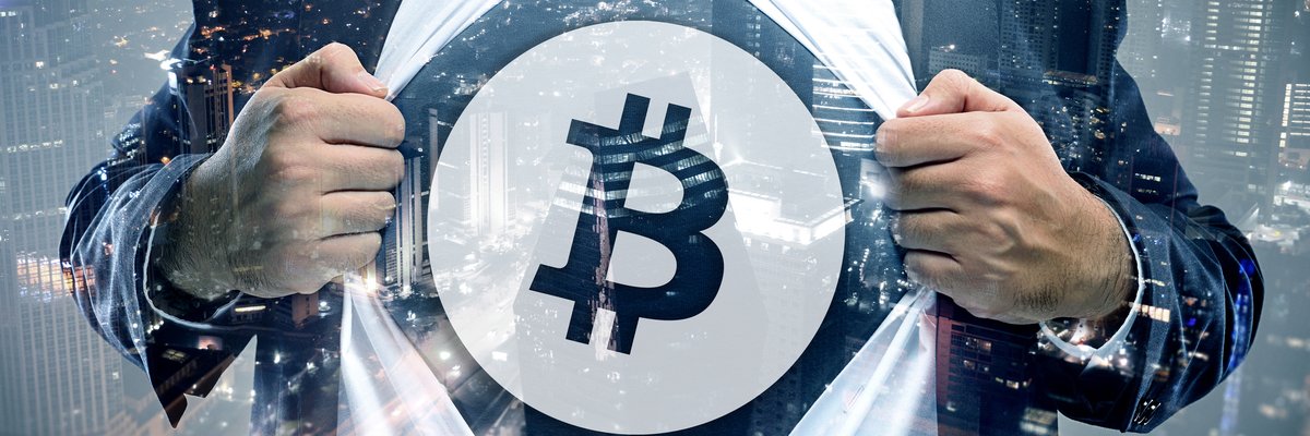 Bussinessman revealing Bitcoin symbol beneath suit