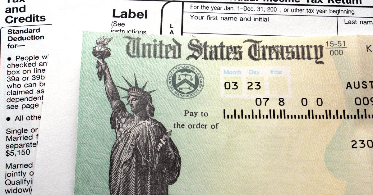 A tax check on top of tax forms.