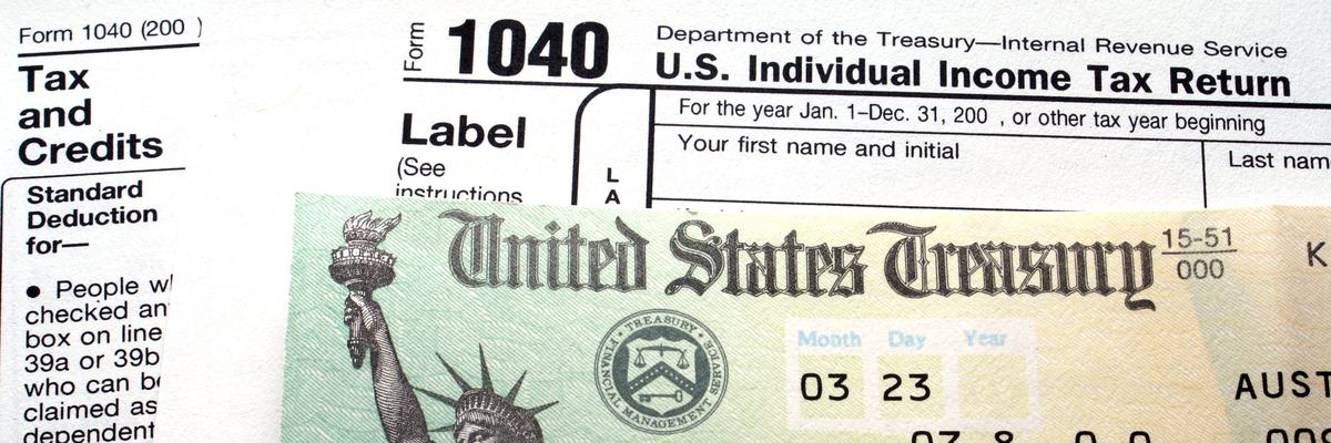 A tax check on top of tax forms.