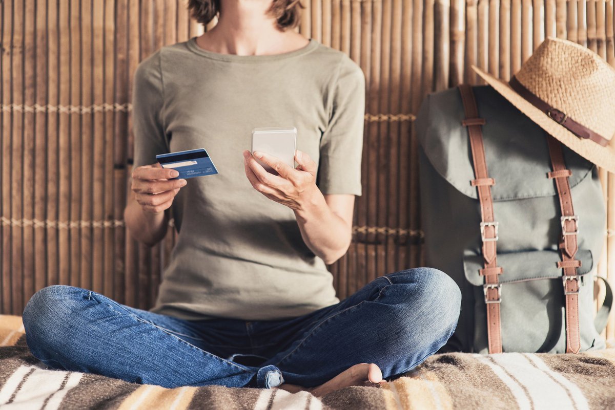 Traveling woman using credit card
