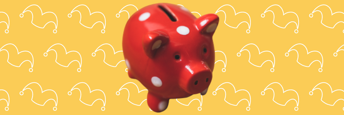 A red piggy bank against a yellow background