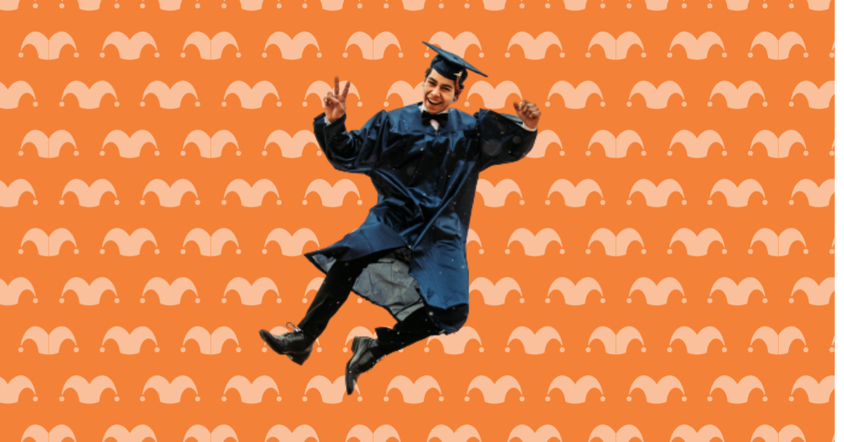 A man dressed in a cap and gown is jumping against an orange background.
