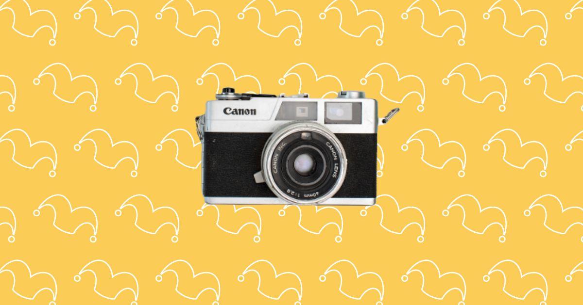 A camera against a yellow background.